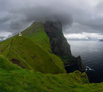 The Kallur lighthouse on the island of Kalsoy, Faeroe islands, Denmark, Europe